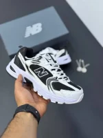 کتونی نیوبالانس ۵۳۰ مشکی سفید با رویه چرم و مش و زیره مقاوم