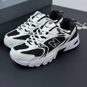 کتونی نیوبالانس ۵۳۰ مشکی سفید با رویه چرم و مش و زیره مقاوم