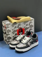 کتونی بیپ هیوگو مشکی با چرم براق و لوگوی نقرهای در پسزمینه روشن