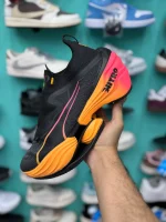 کتونی پوما فست-آر‌بی نیترو الیت بلک سان با مش مشکی و کفی آفتابی در پس‌زمینه روشن