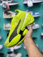 کتونی پوما فست-آر‌بی نیترو الیت لایم پاو با مش لایم پاو و صورتی در پس‌زمینه روشن